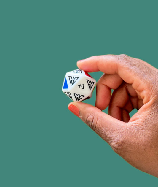 Hand holding a colorful gaming die perfect for family game night dice activities